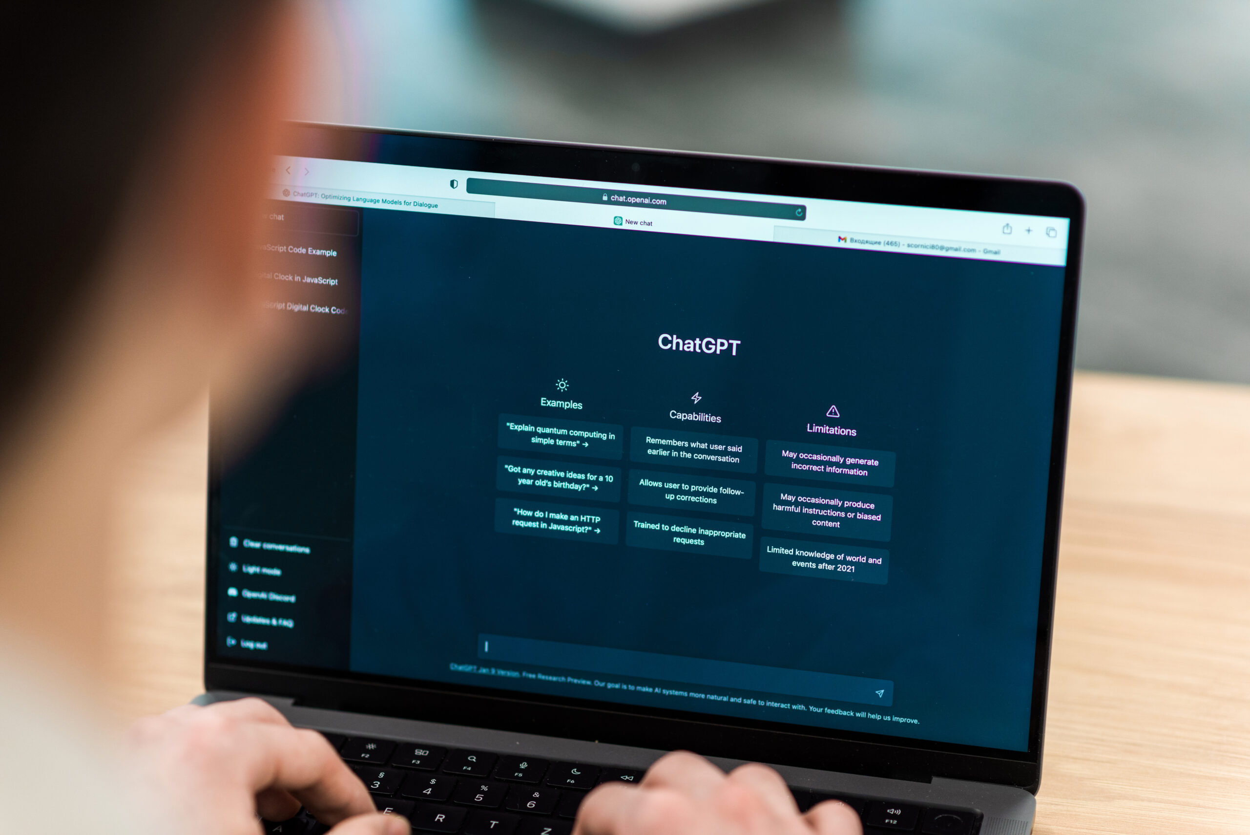 Opened AI chat on laptop a man looking at a screen with chatgpt on it